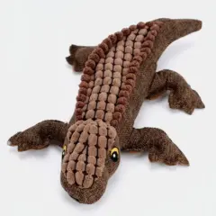 Brinquedo de pelúcia crocodilo para cães sozinho sobre fundo claro