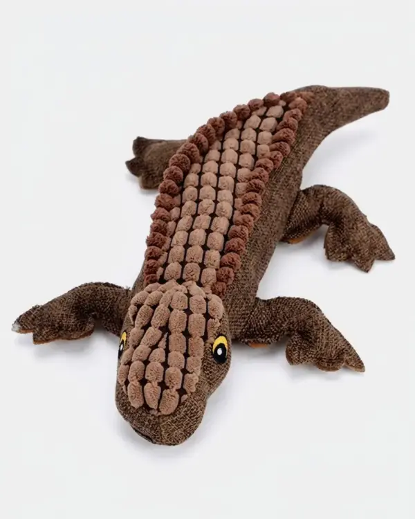 Brinquedo de pelúcia crocodilo para cães sozinho sobre fundo claro